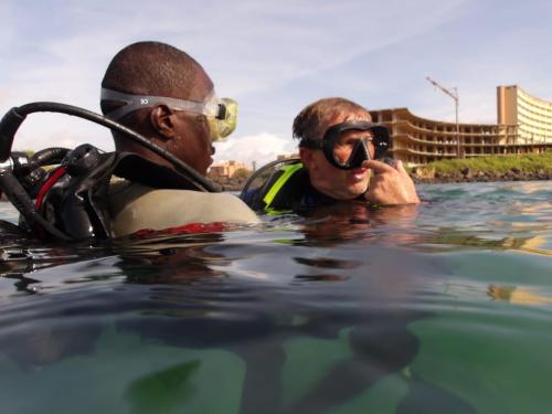 divers with heads above water