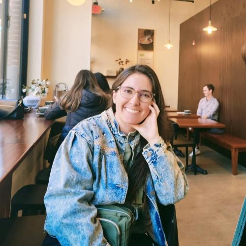 Maria Jose Pelaez-Sierra sits in a coffee shop