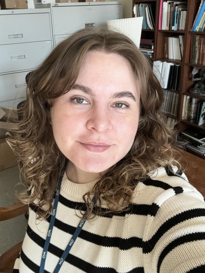 Woman in a striped sweater smiling